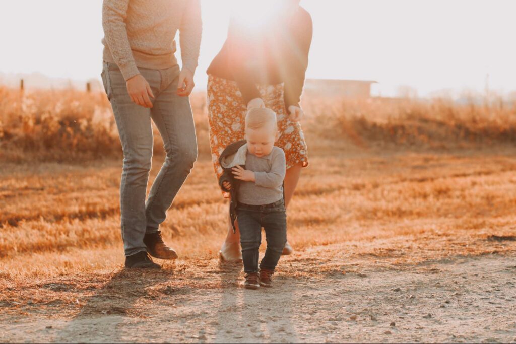 This is an image of two co-parents spending time with their child.