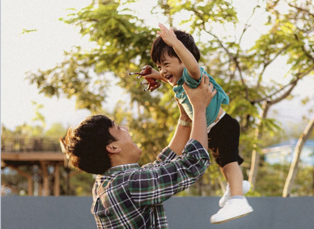 This is an image of a father playing with his child.