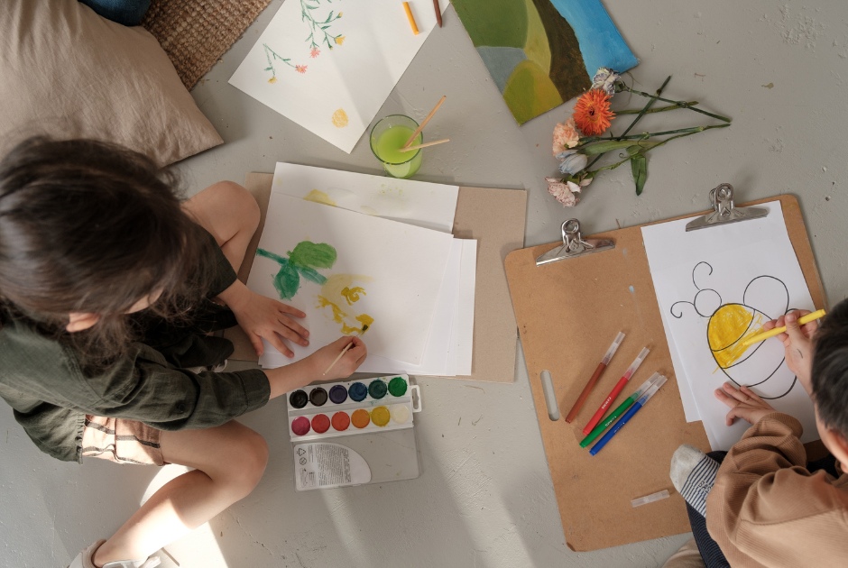 This is an image of several children making artwork.