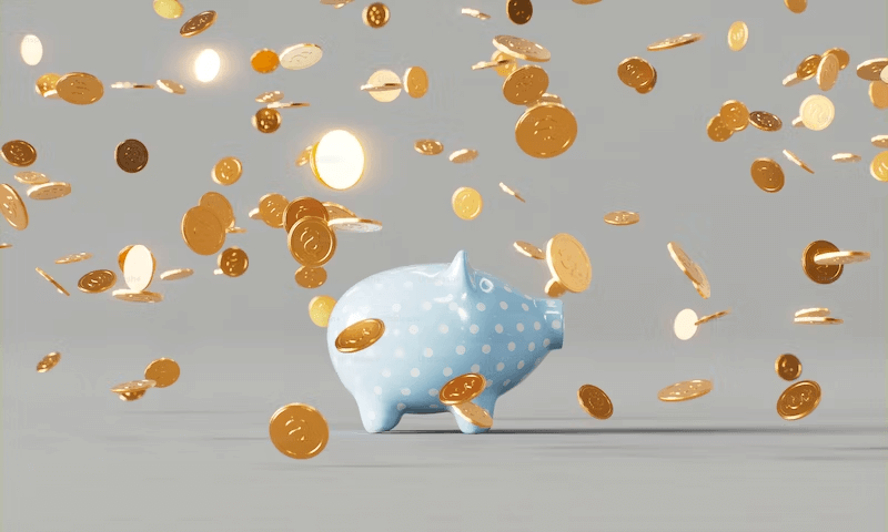 Image of a piggy bank with gold coins falling. Cost of Divorce.