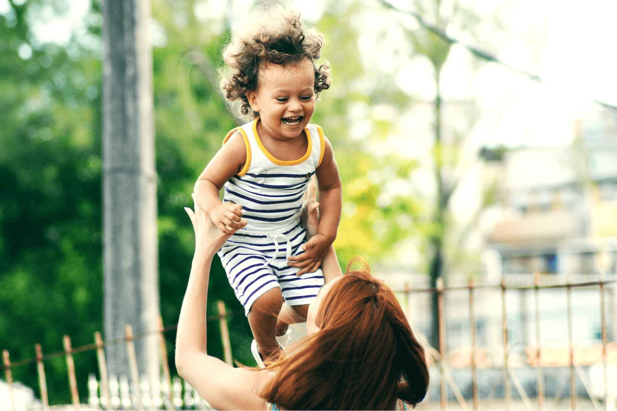 Child being picked up by parent